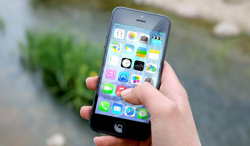 Person Holding Iphone. 5 things to avoid on social media - Mosaic Publicity
