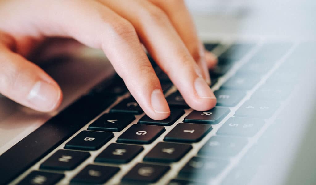 10 top tips for writing captivating website - Mosaic Publicity - Person typing on macbook keyboard